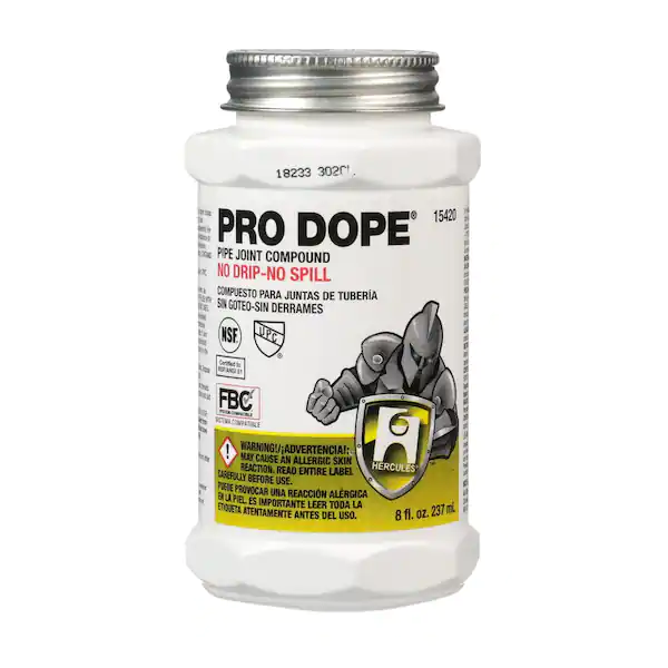 A white 8 oz. container of Hercules Pro Dope pipe joint compound, labeled "No Drip-No Spill," with a knight logo and warning label visible.