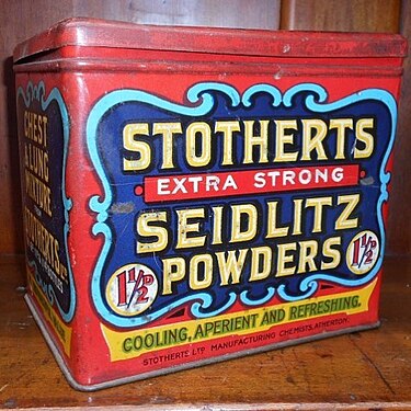 A vintage red tin labeled "Stotherts Extra Strong Seidlitz Powders," advertising cooling, aperient, and refreshing effects.